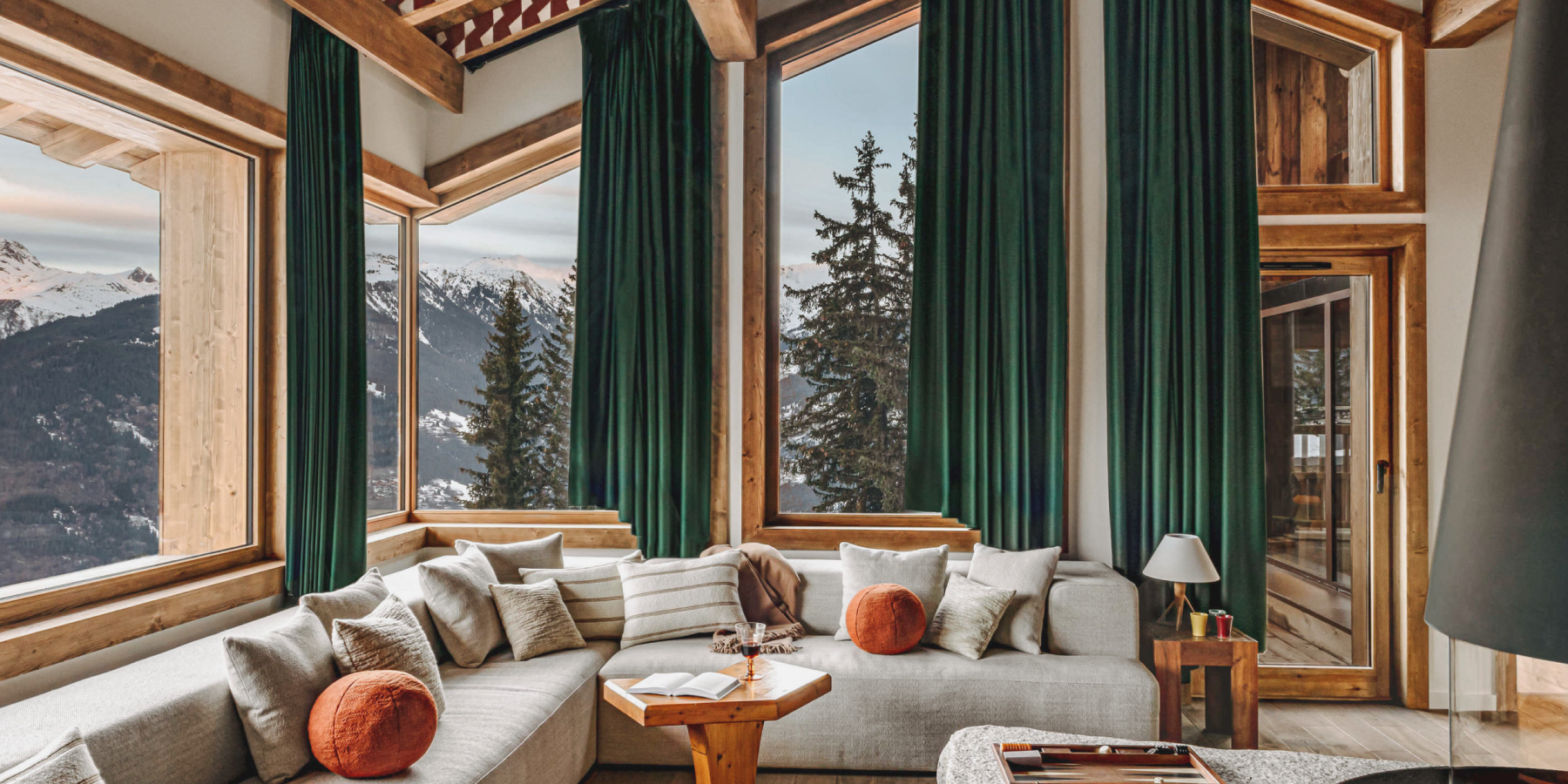 Mountain view from a cozy chalet living room.